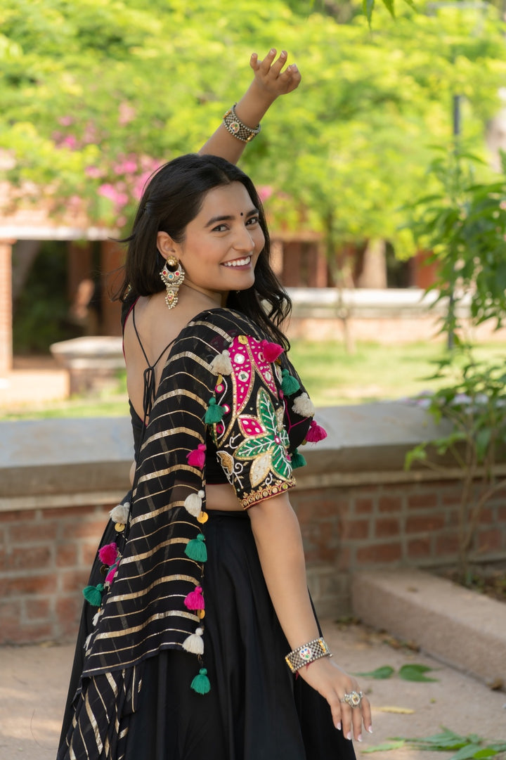 Black designer Navratri cotton satin lehenga set with multicolour detailing and mirror work blouse and georgette dupatta garba outfit 