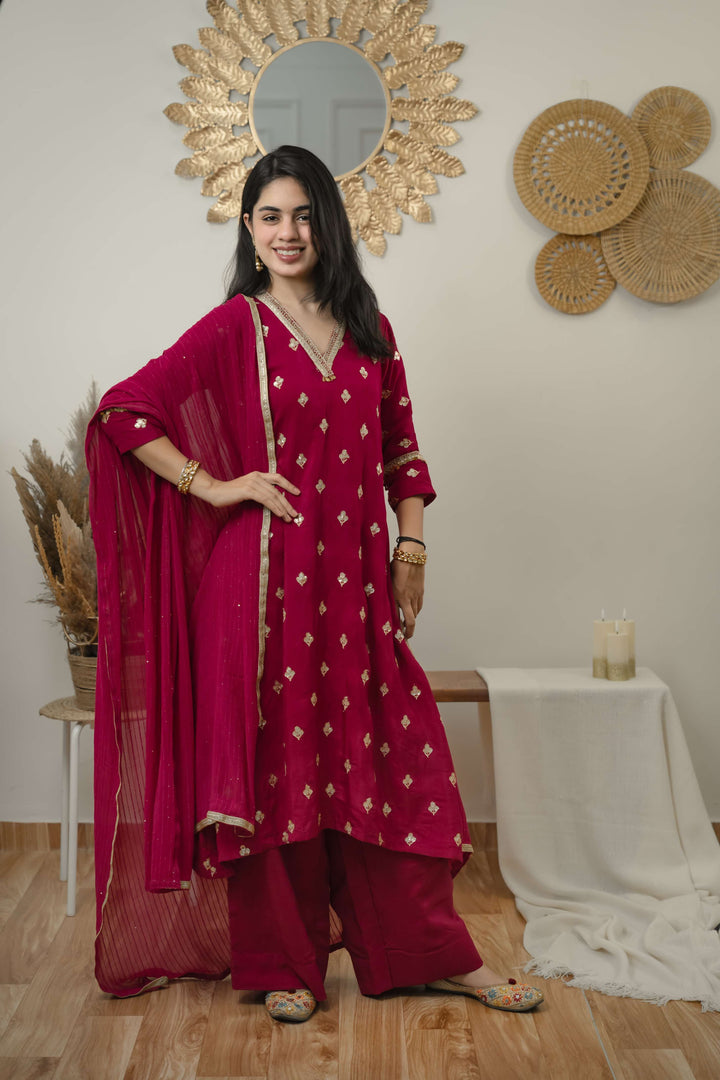 Hot pink silk kurta set with butti work and lace details in neckline and sleeve ,perfect for festive wear.