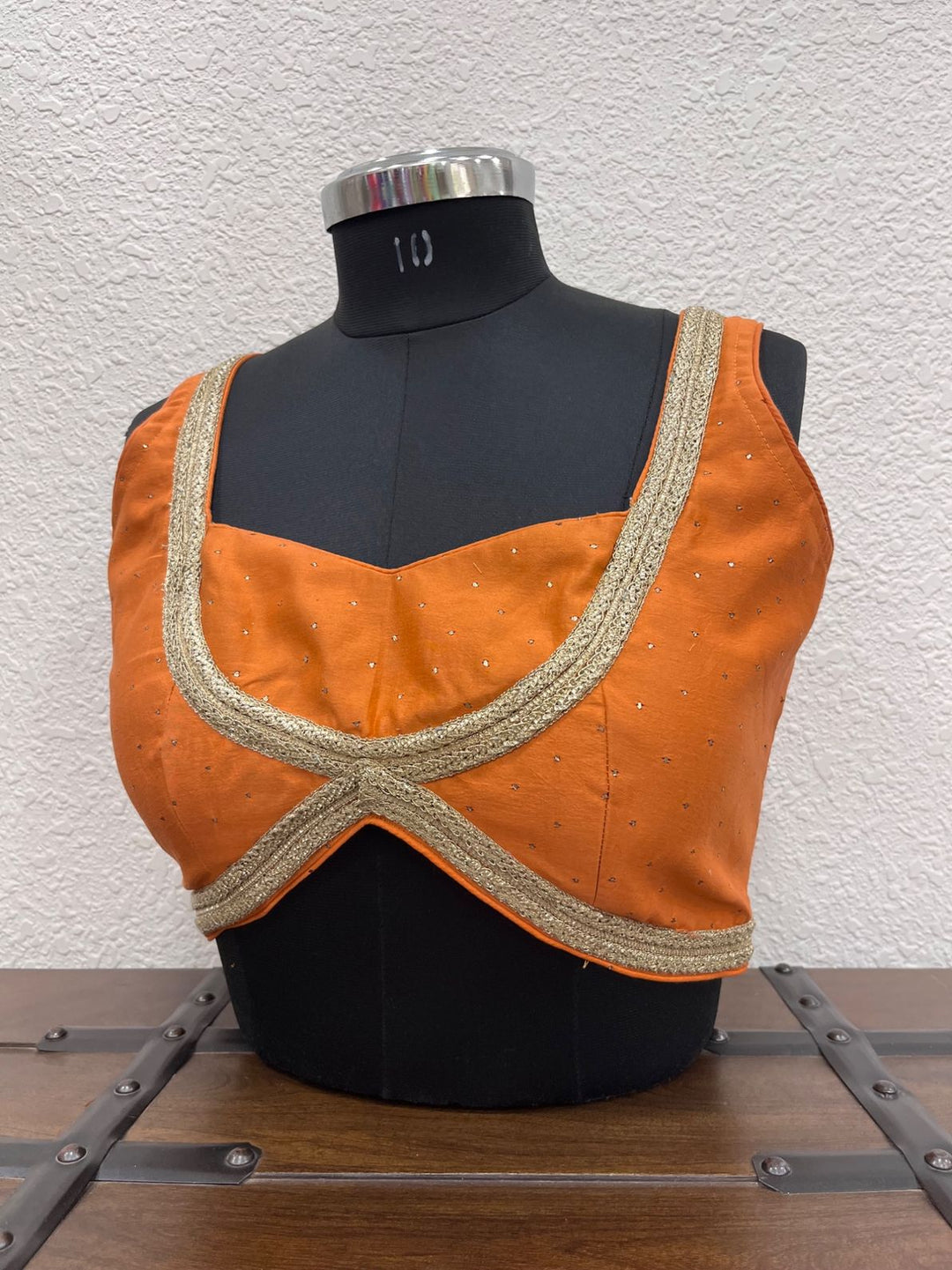 Orange mul cotton blouse with hand Mukesh work and golden lace detailing