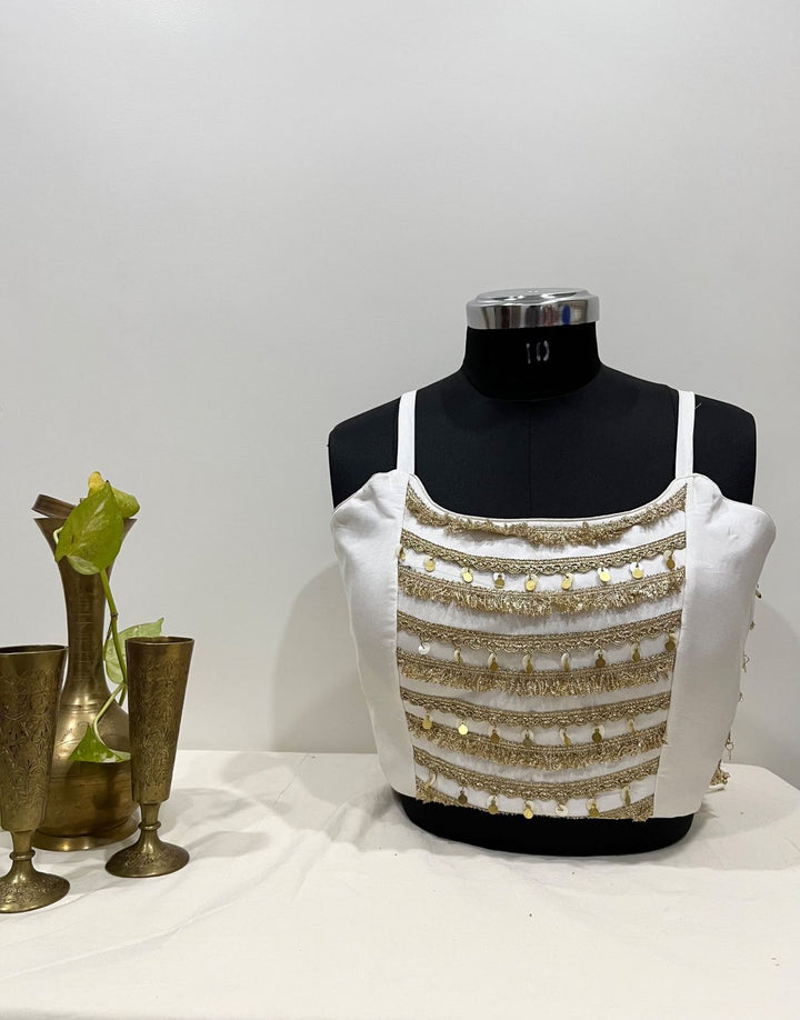 Off white sleeveless chanderi silk gold detailing blouse for festive and Navratri wear 