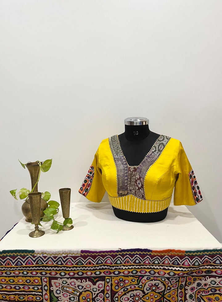 Yellow gajji silk multicolour Banarasi border and kutchi patchwork detailing blouse 