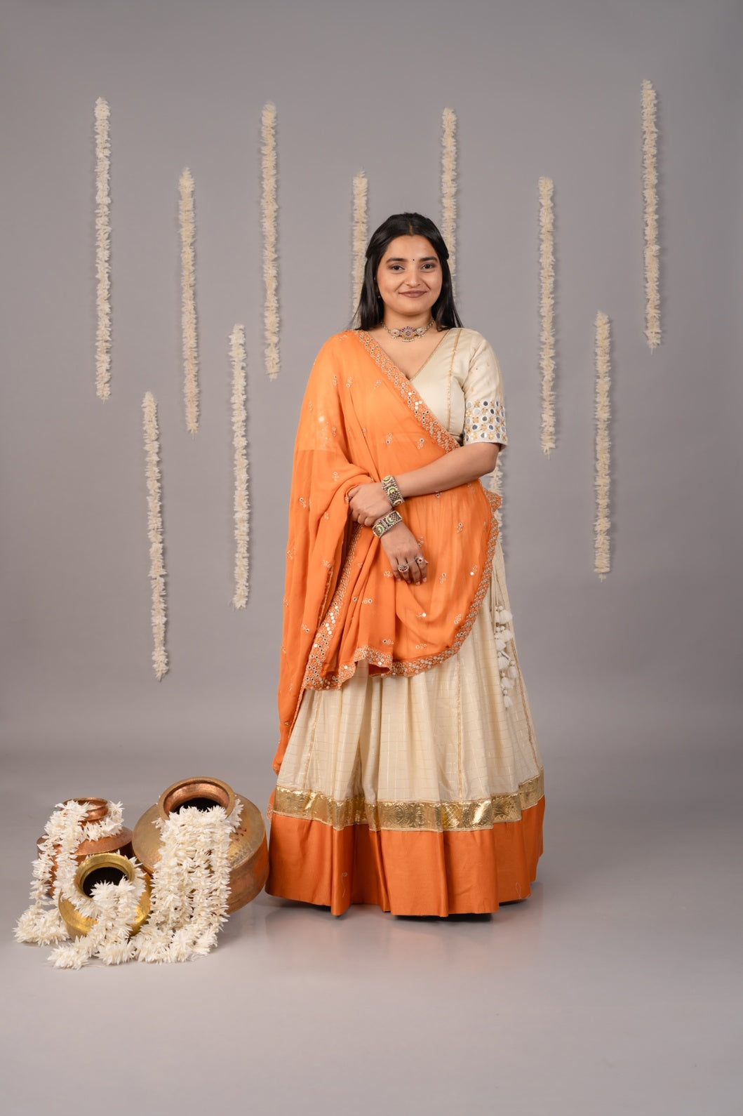 Beige & light orange festive Navratri lehenga and blouse with mirror work and dupatta 