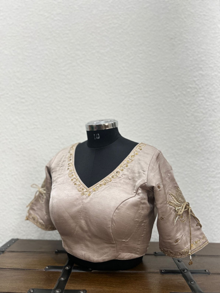 Beige traditional blouse with handcrafted lotus embroidery and detailed sleeve work