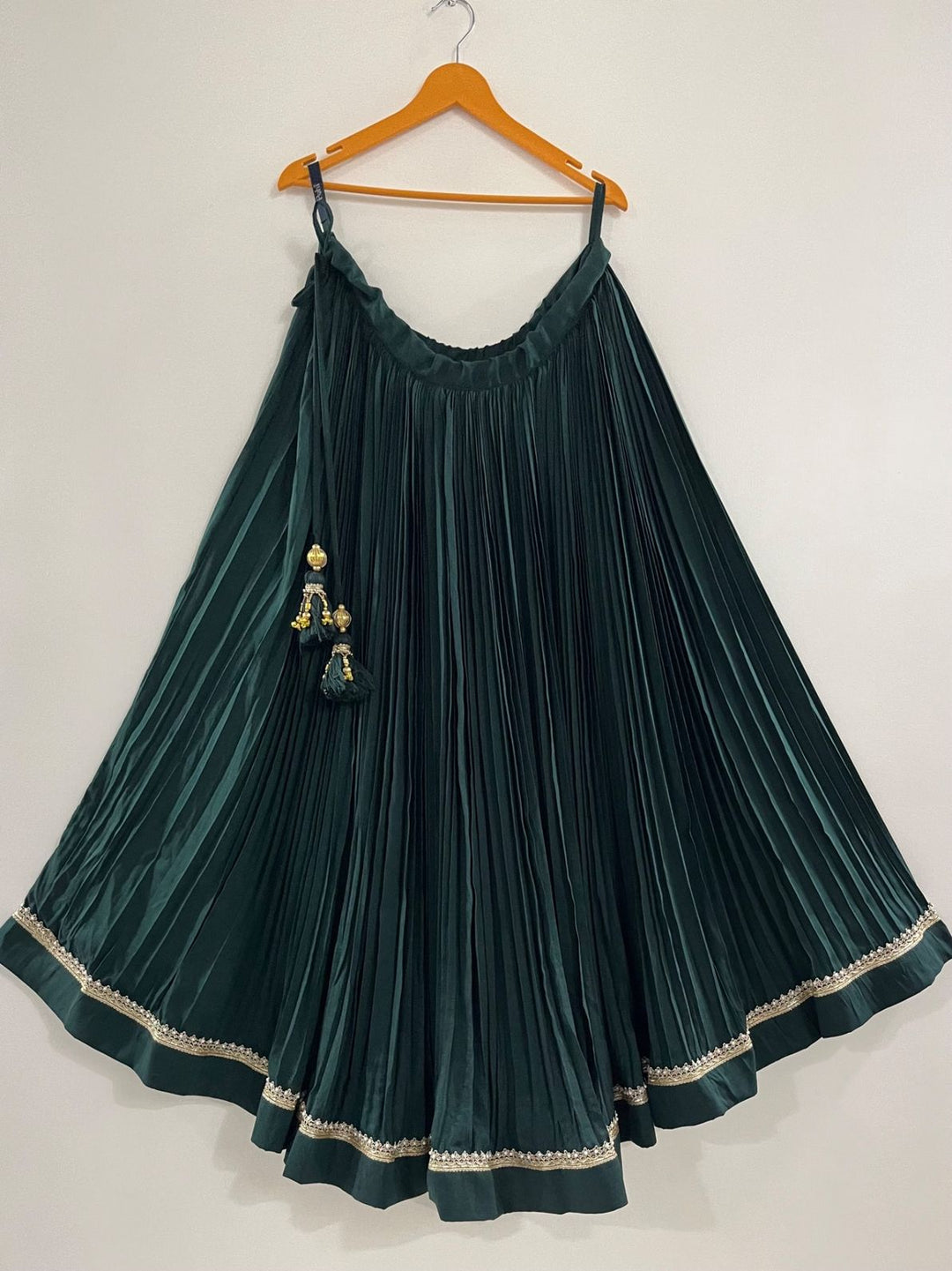 Green pleated chaniya with golden border perfect for navratri wedding garba night and puja function 