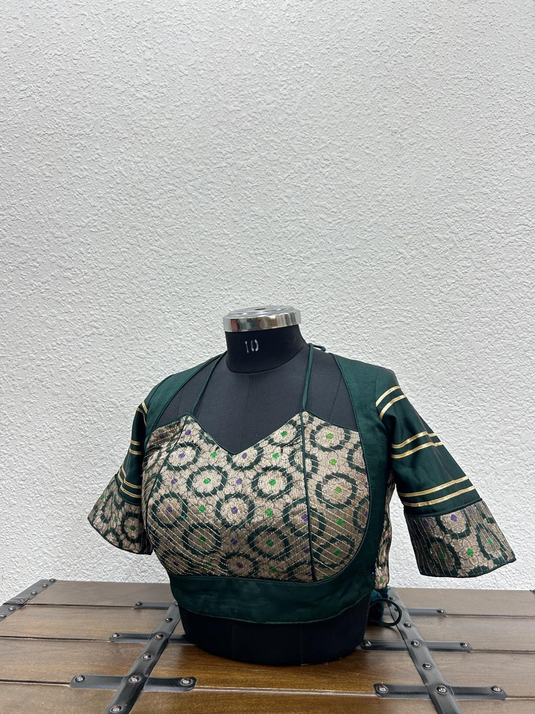 Dark green raw silk blouse with Banarasi front panel and kasab detailing