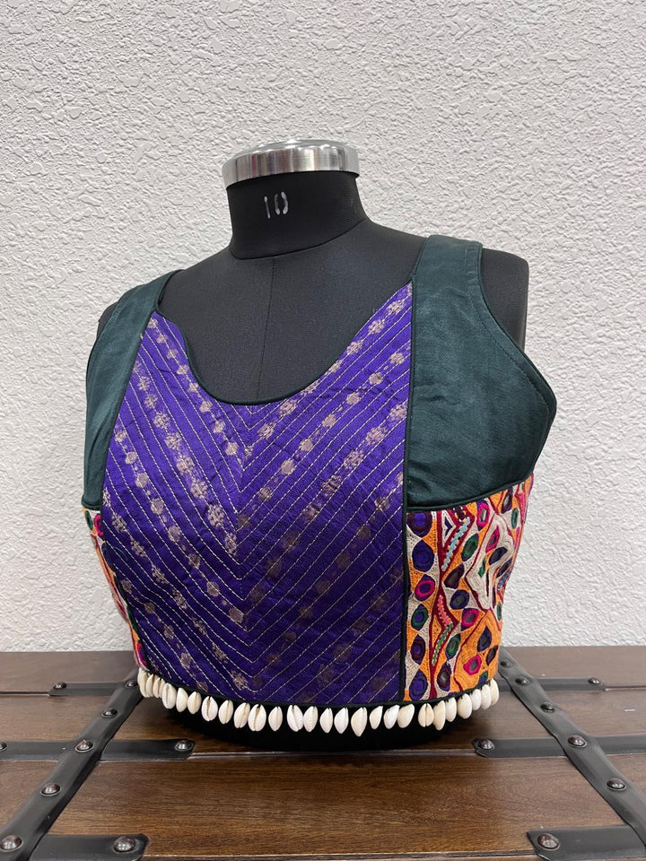 Dark green raw silk blouse with Banarasi panel and Kutchi patch detailing
