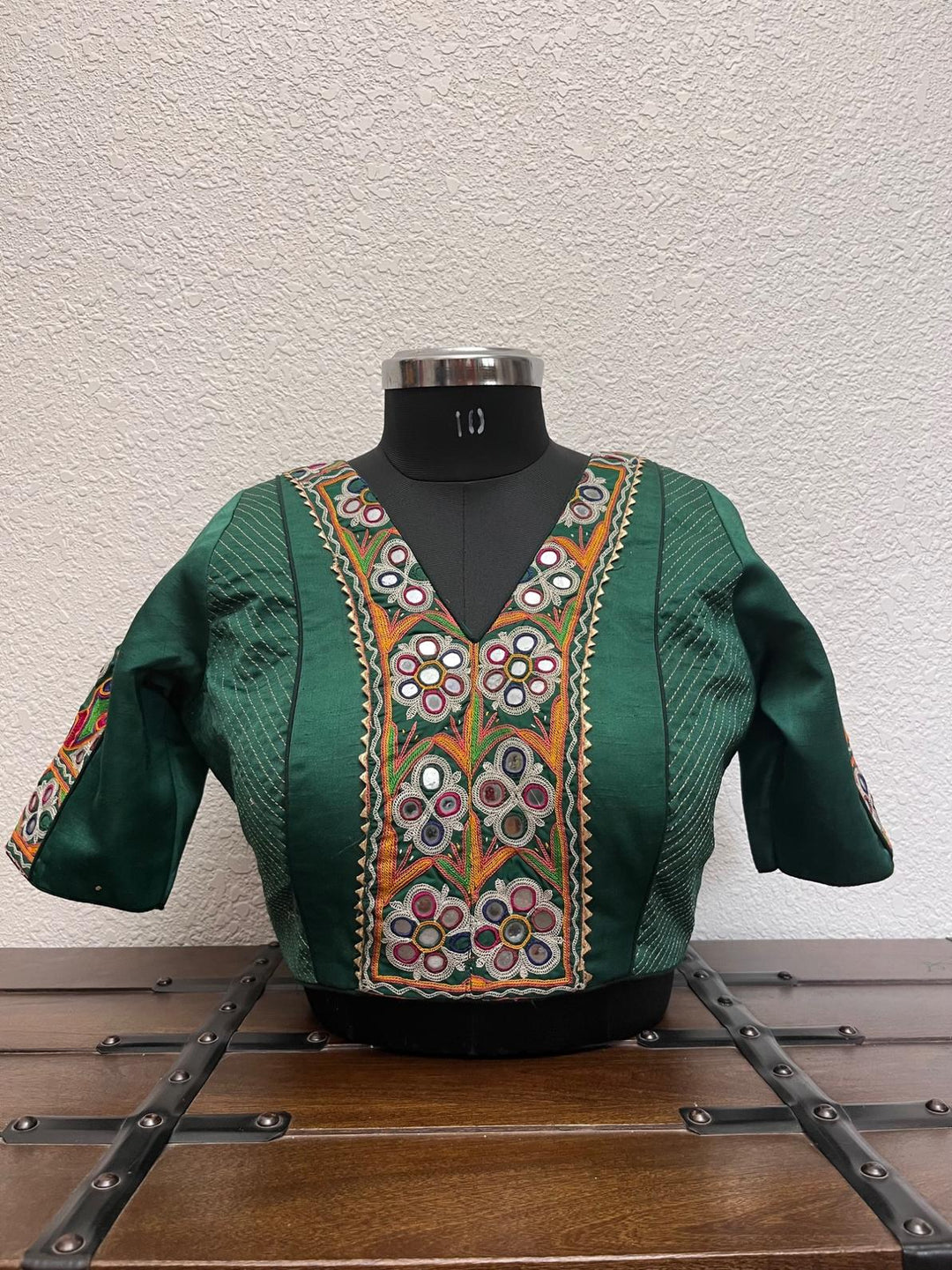 Dark green blouse with kachi patch work, kasab detailing, Banarasi border, and gota lace finish