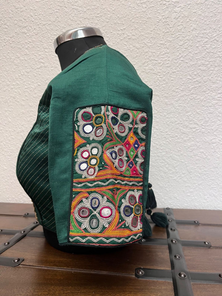 Dark green blouse with kachi patch work, kasab detailing, Banarasi border, and gota lace finish
