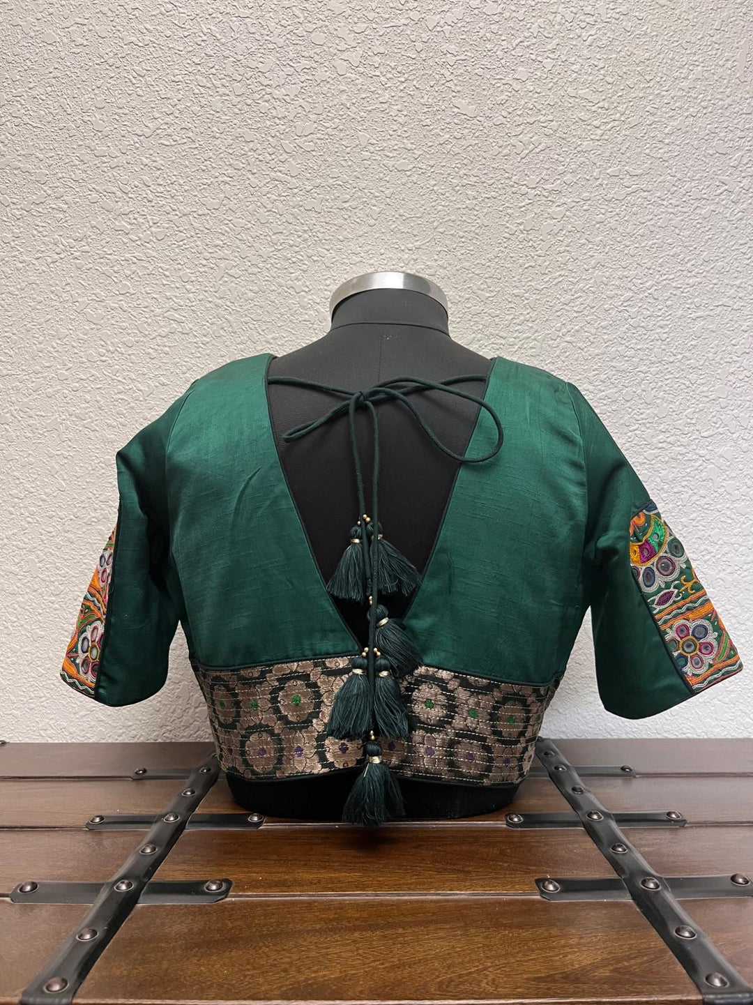 Dark green blouse Gujarati kachi patch work, kasab detailing, gamthi work,Banarasi border, and gota lace finish
