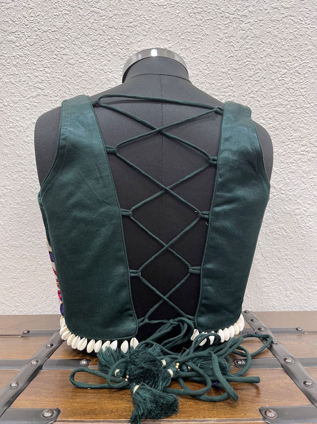 Designer dark green Navratri blouse with kodi border and dori back