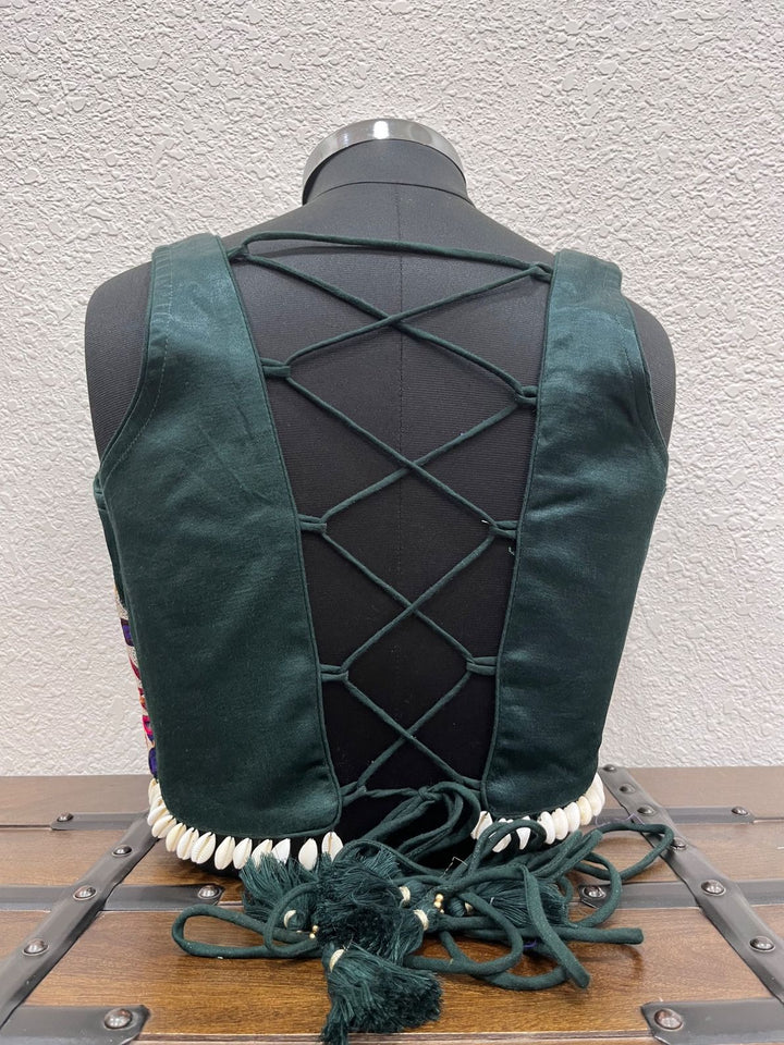 Designer dark green Navratri blouse with kodi border and dori back
