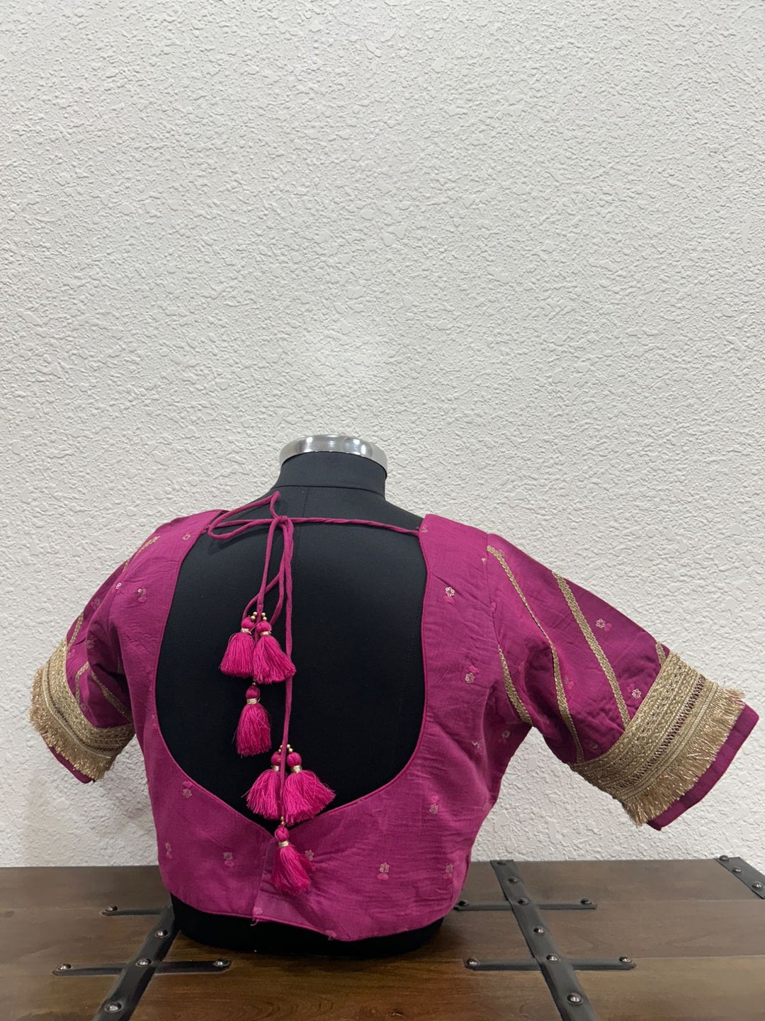 Festive designer blouse crafted in lightweight Chanderi fabric with lace accents