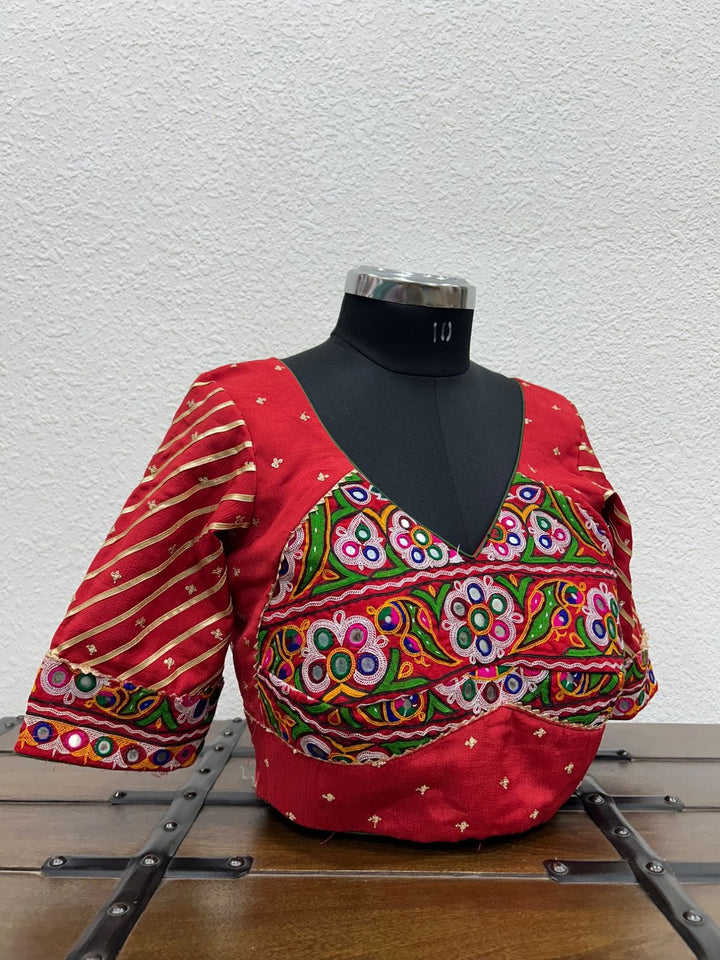Designer festive blouse with traditional Kutchi embroidery and elegant lace sleeve detailing