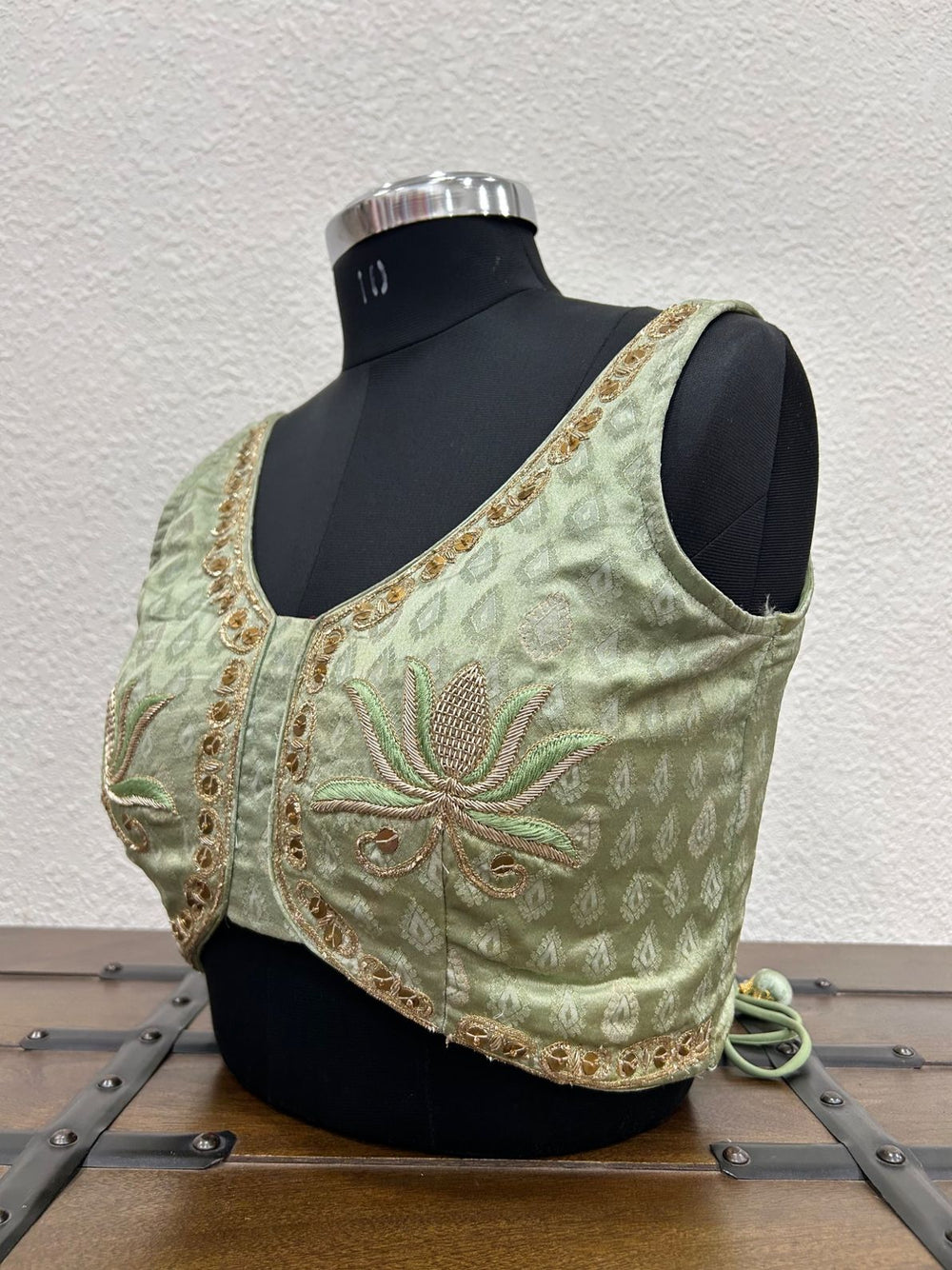 
Designer festive blouse featuring elegant lotus hand embroidery and traditional craftsmanship