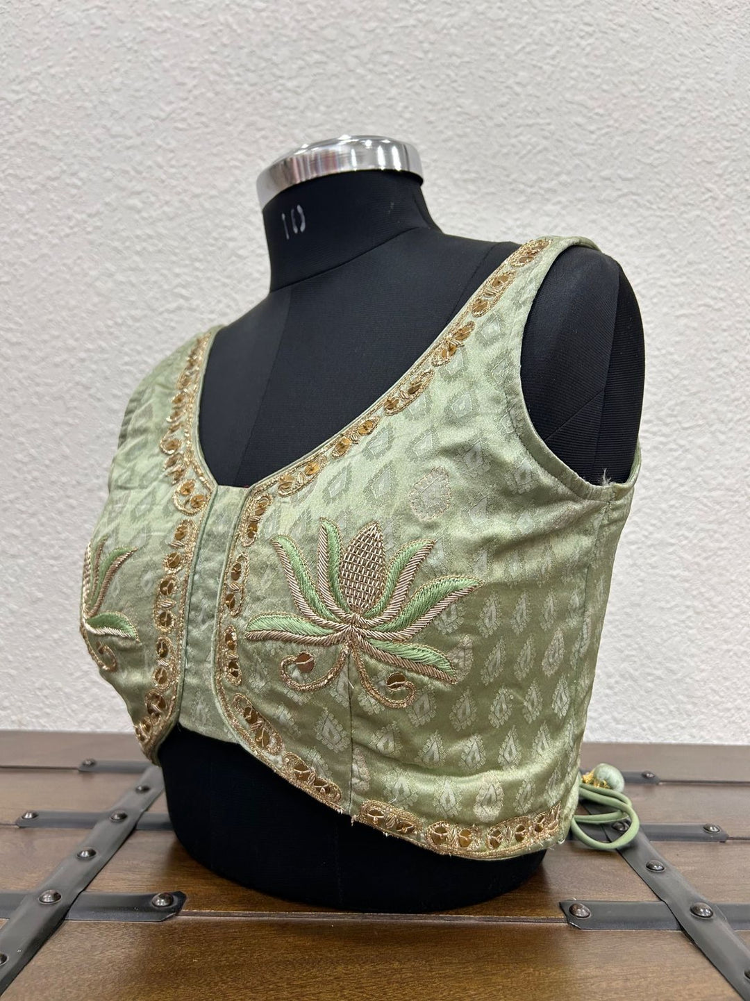 
Designer festive blouse featuring elegant lotus hand embroidery and traditional craftsmanship