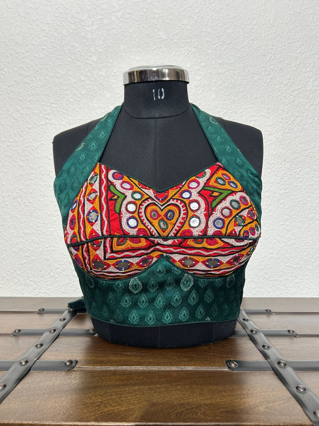 Emerald green halter neck blouse with Kutchi mirror embroidery work