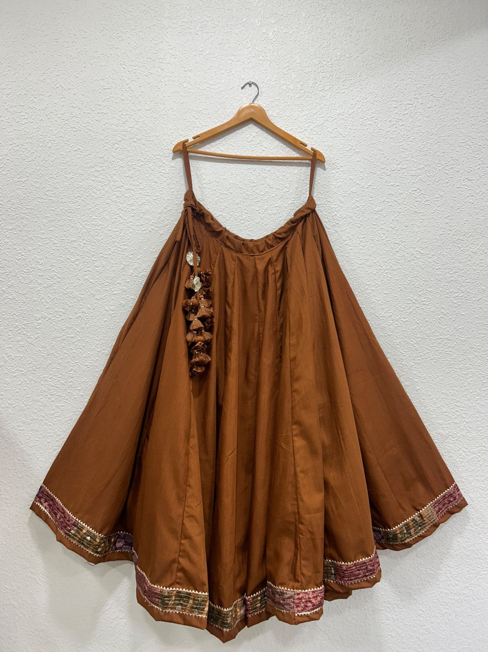 Festive Garba chaniya featuring rich Banarasi border and graceful flare