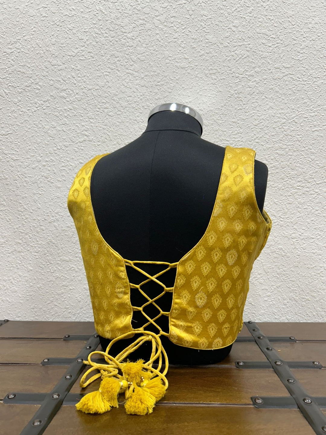 Festive designer blouse featuring stylish criss cross dori back design