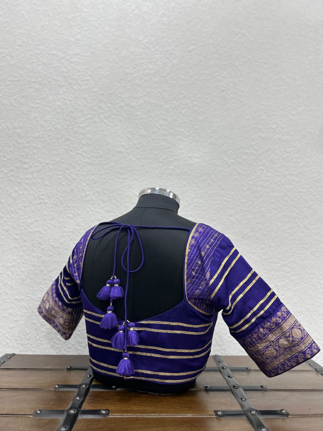 Festive designer blouse with elegant lace accents and Banarasi sleeve detailing