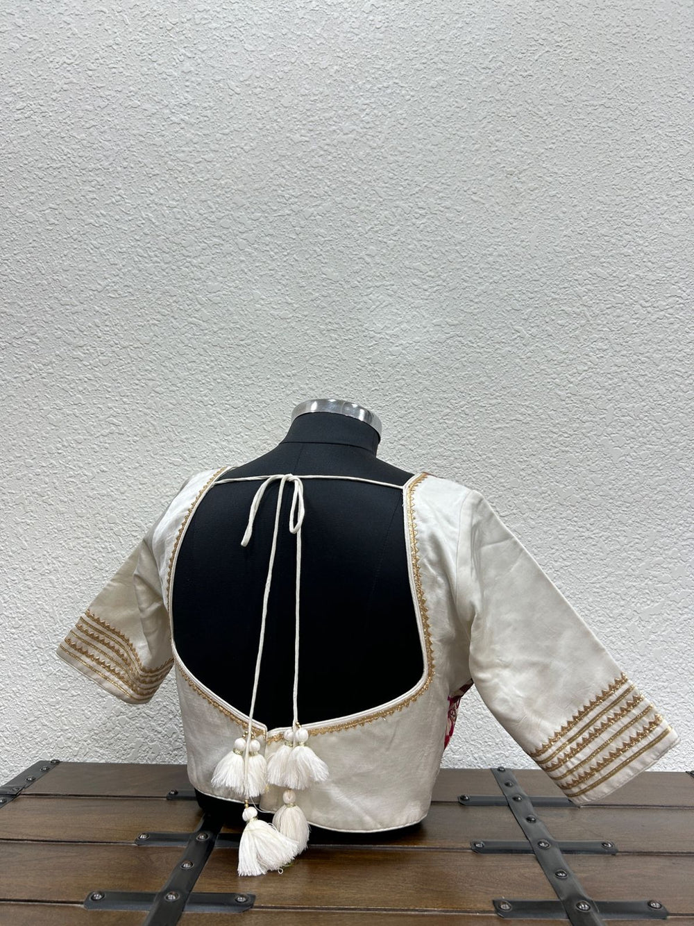 Festive designer blouse with handcrafted mirror-inspired work and golden triangle lace sleeves