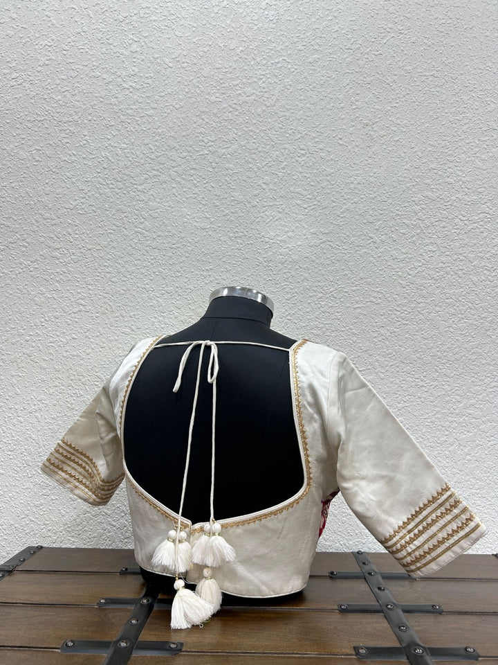 Festive designer blouse with handcrafted mirror-inspired work and golden triangle lace sleeves