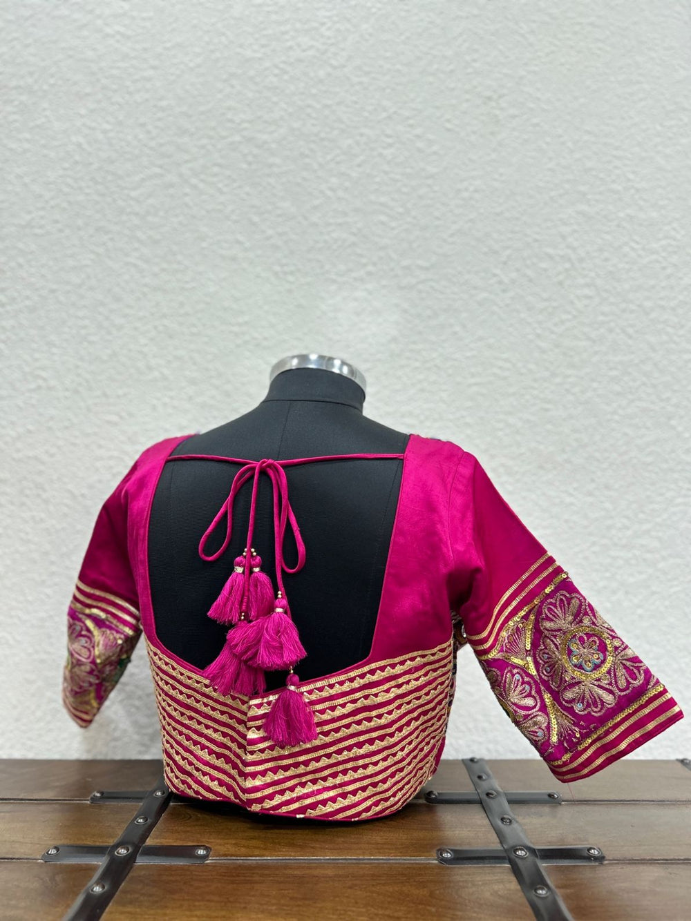 Festive designer blouse featuring handcrafted sleeve patchwork and elegant ethnic detailing