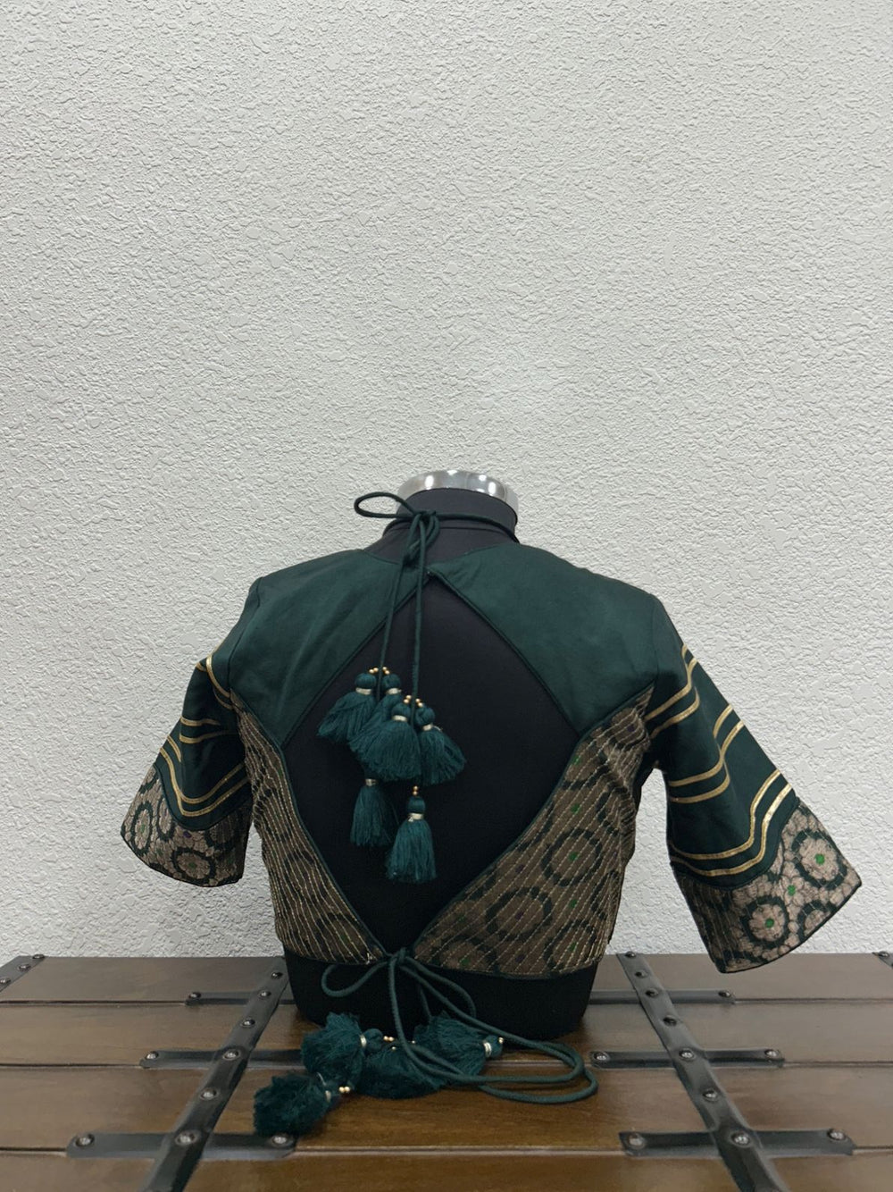 Designer dark green festive blouse with Banarasi sleeves and lace detailing