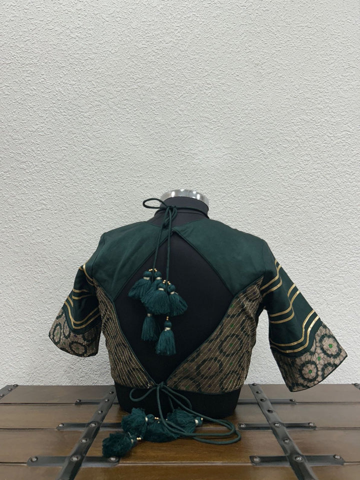 Designer dark green festive blouse with Banarasi sleeves and lace detailing