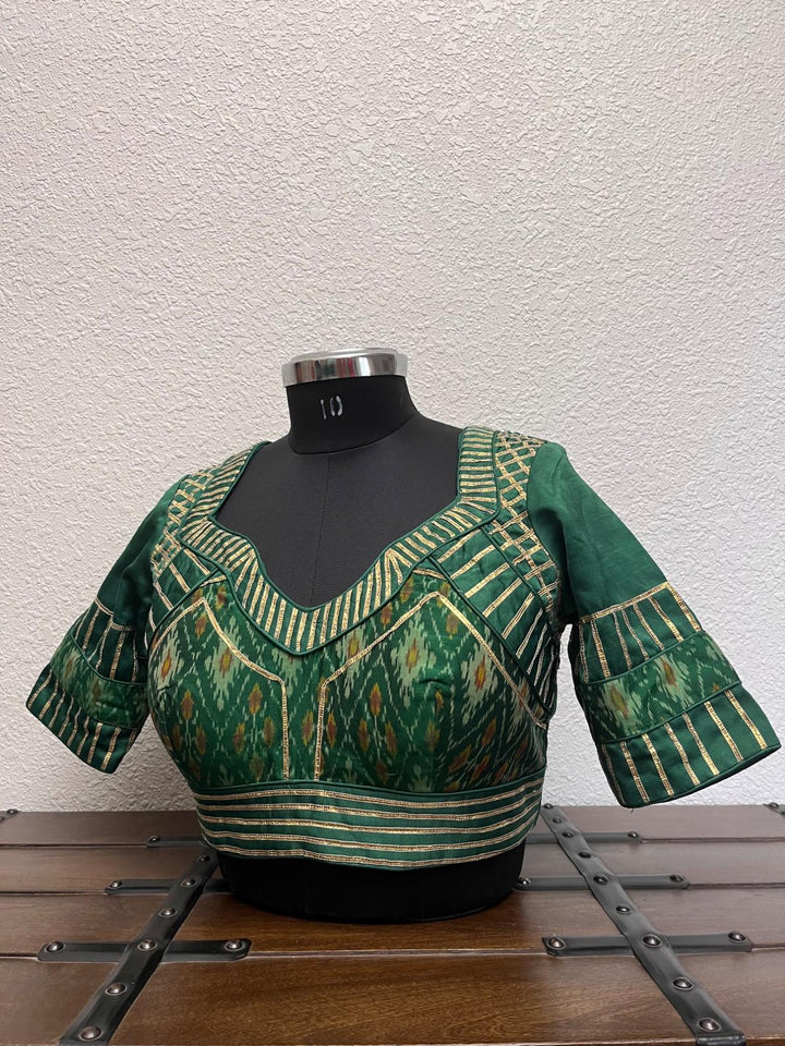 Green Patola raw silk Navratri blouse with crush gota lace detailing by Pohi Studio