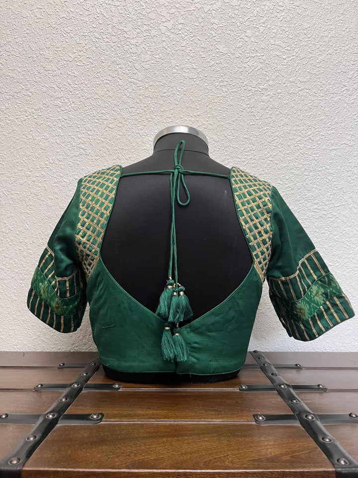 Green ikkat Patola raw silk Navratri blouse with crush tissue lace detailing by Pohi Studio