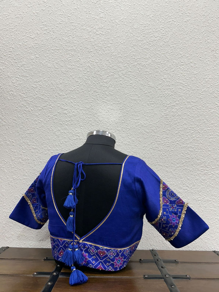 Handcrafted festive blouse with elegant traditional detailing and refined silhouette