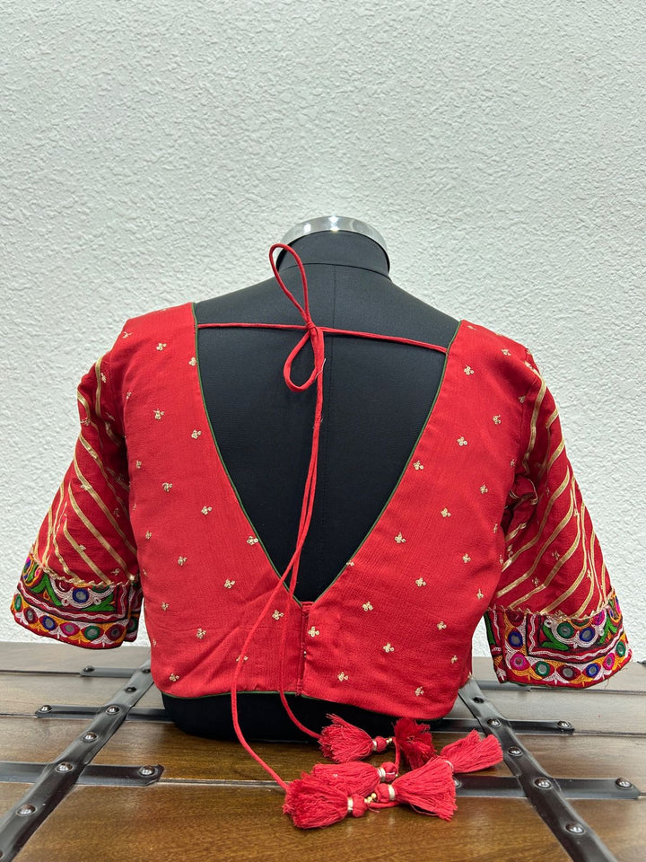Handcrafted Chinon chiffon Navratri blouse with intricate Kutchi work and festive craftsmanship