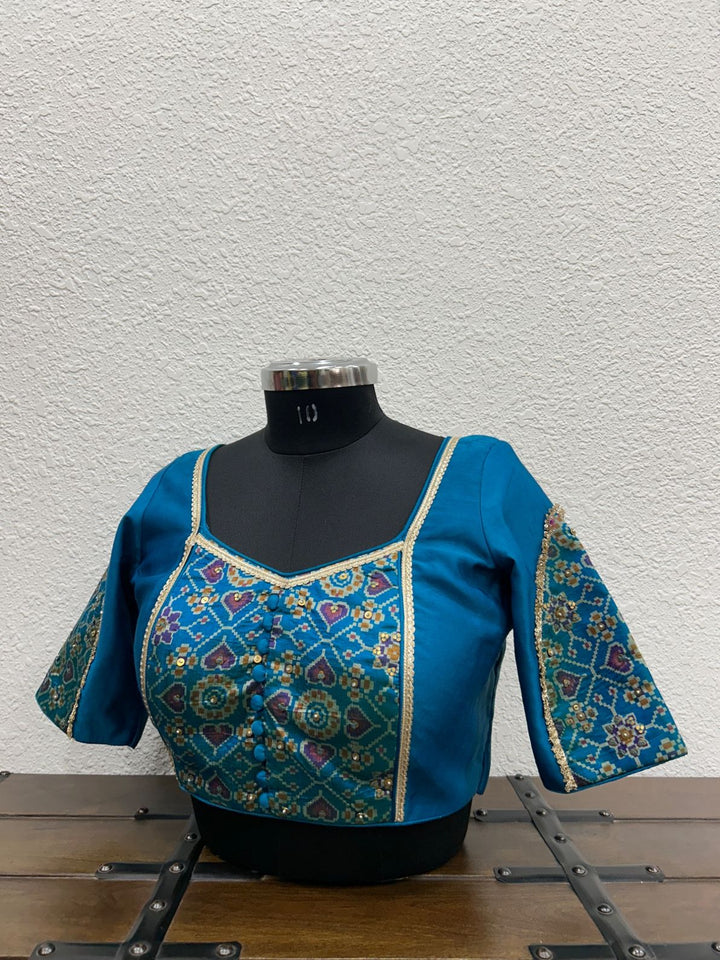 Raw silk festive blouse with elegant Ikkat Patola front detailing