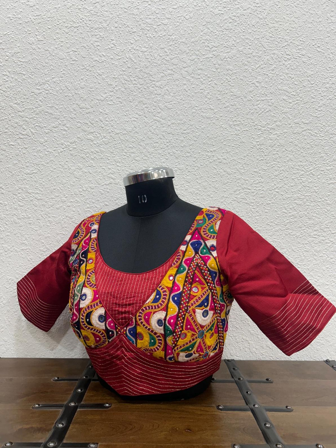 Maroon raw silk blouse with vibrant Kutchi patch detailing and festive finish
