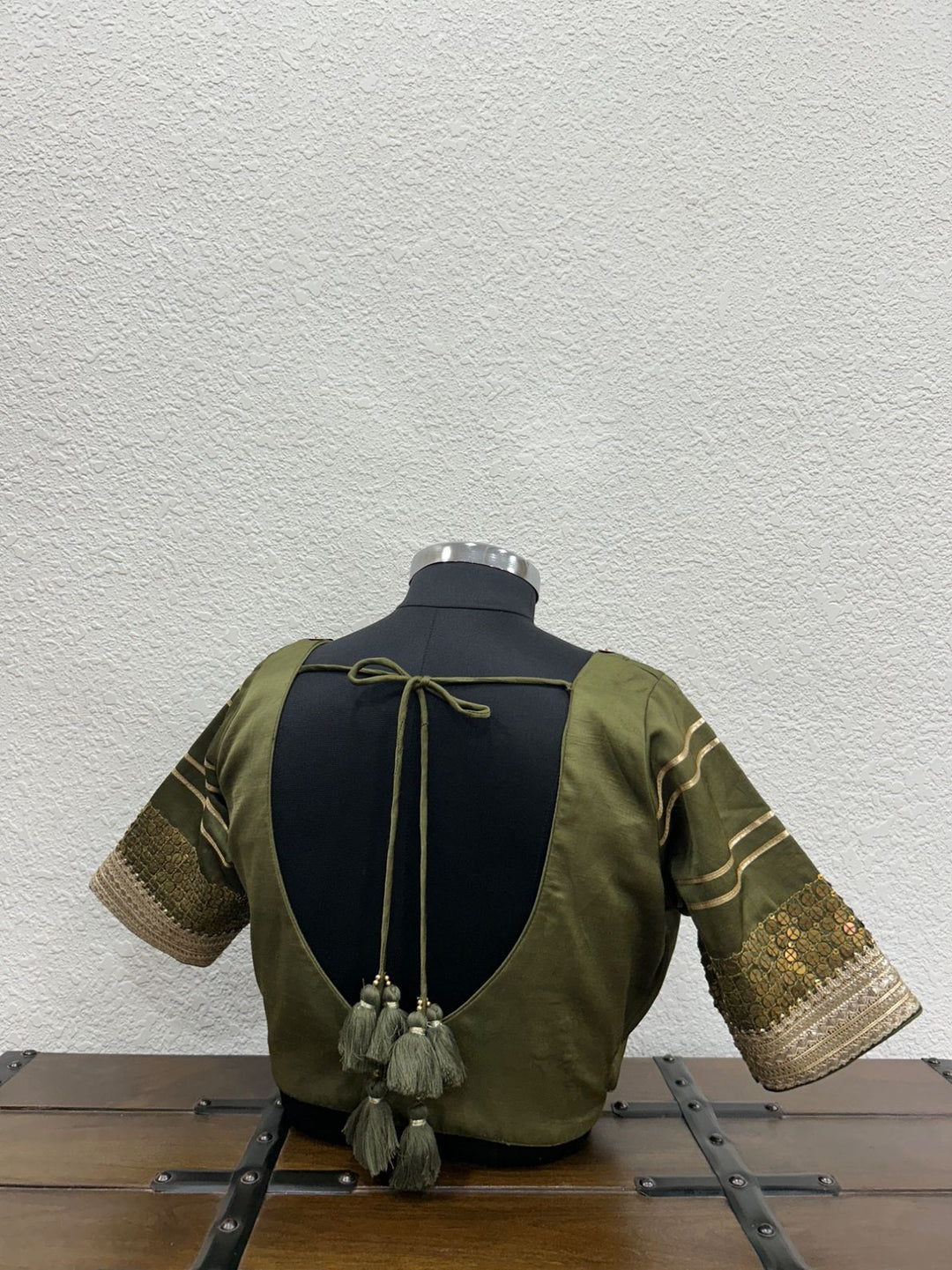 Traditional mehendi green festive blouse with handcrafted tikki work and elegant lace sleeves