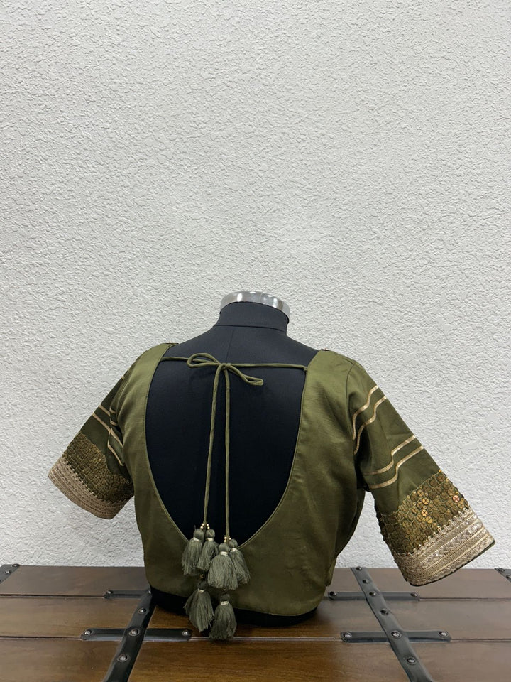 Traditional mehendi green festive blouse with handcrafted tikki work and elegant lace sleeves