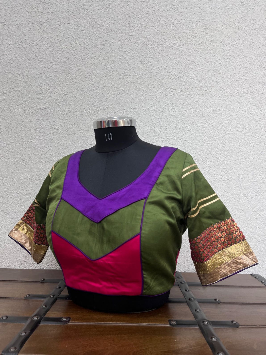 Mehendi green raw silk satin blouse with purple piping and copper tikki work