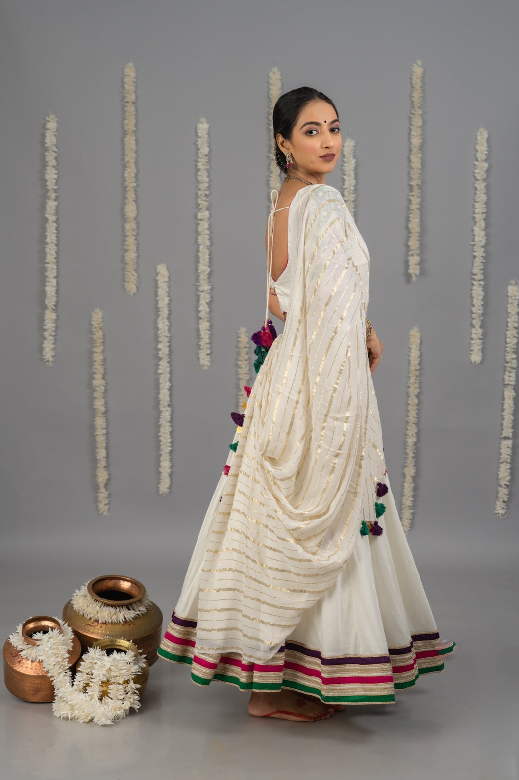 off white designer Navratri cotton satin lehenga set with multicolour detailing and mirror work blouse and georgette dupatta garba outfit 