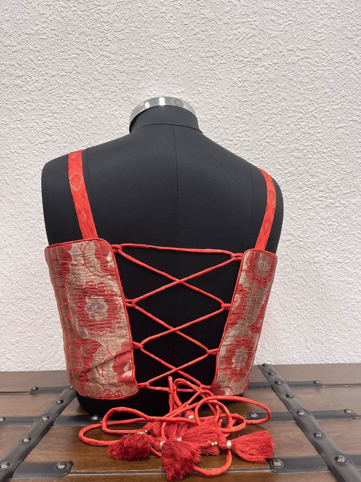 Designer orange red festive blouse with sweetheart neckline and Banarasi fabric