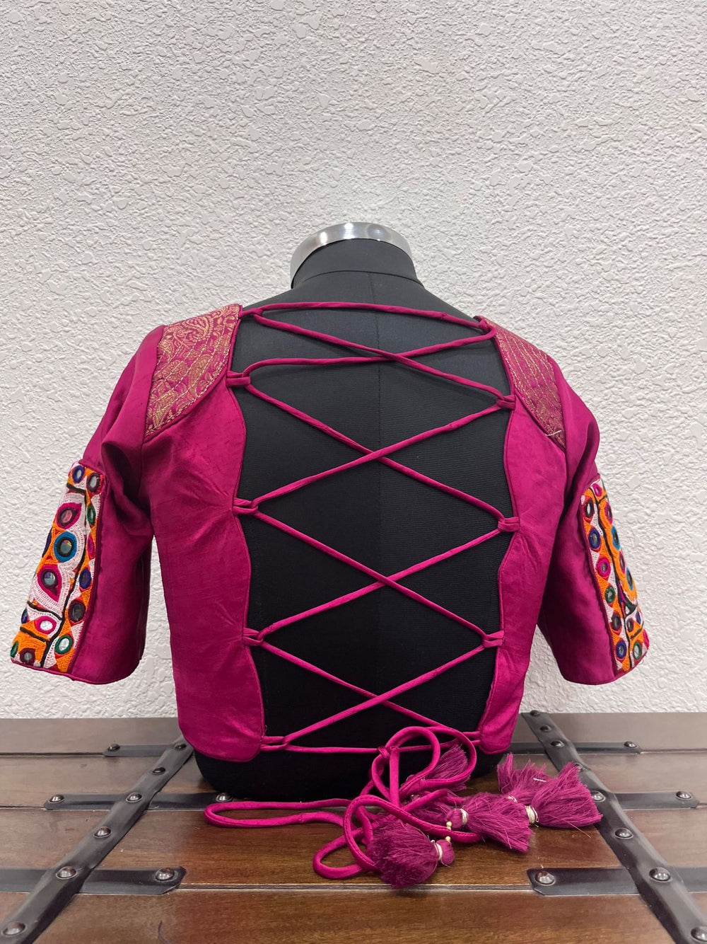 Backless pink Navratri blouse with criss cross dori and coin detailing