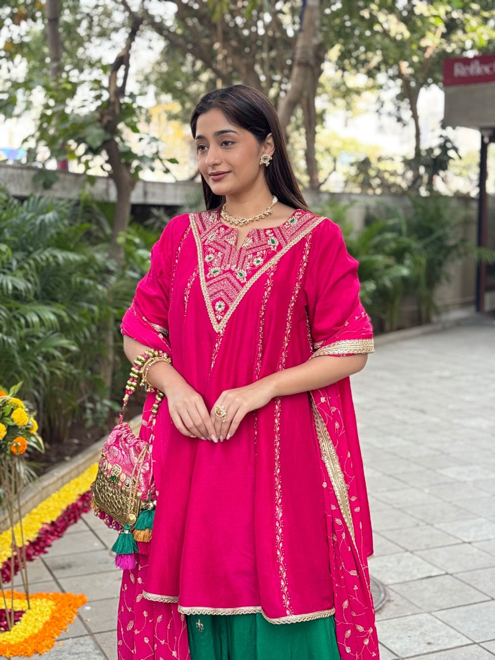 Elegant pink Anarkali ethnic outfit for festive occasions in India with detailed embroidery.