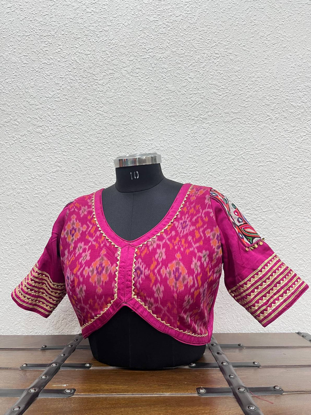 Pink Ikkat Patola blouse with Gamthi work patches and gota lace