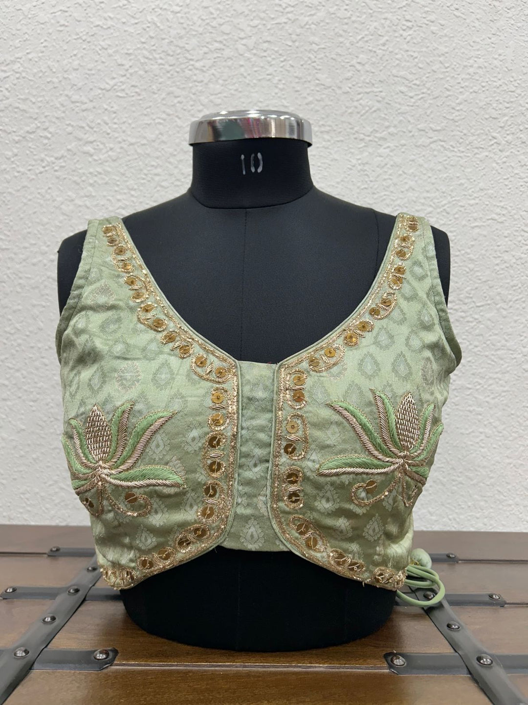 Pista Gajji silk blouse with handcrafted lotus-inspired embroidery detailing