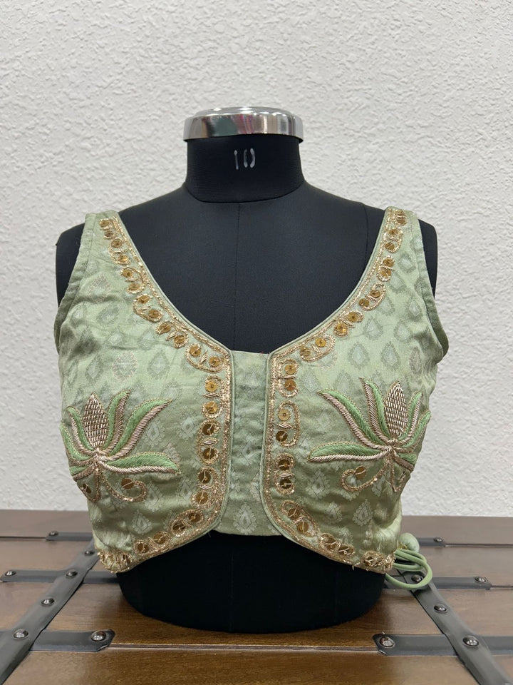 Pista Gajji silk blouse with handcrafted lotus-inspired embroidery detailing