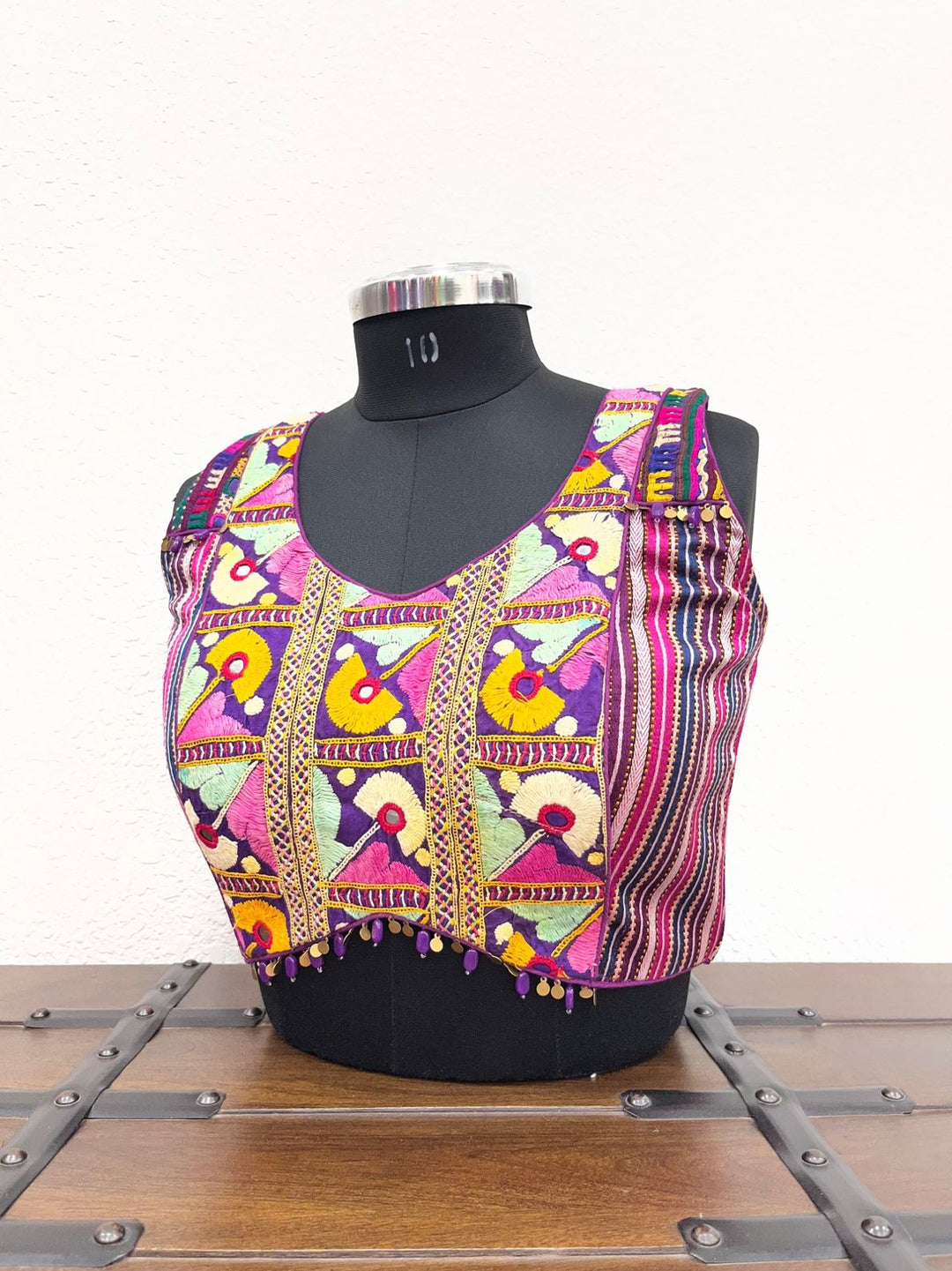 Purple raw silk blouse with all-over Kutchi work and coin lace waist detailing
