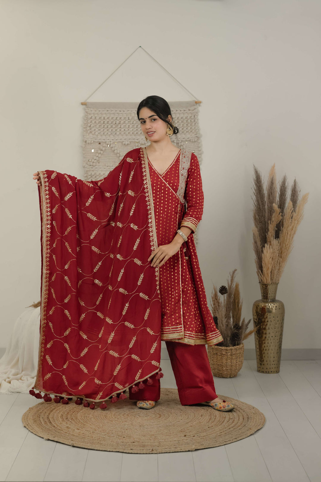 Woman wearing red festive kurta set with dupatta and straight palazzo pants for wedding and ethnic wear