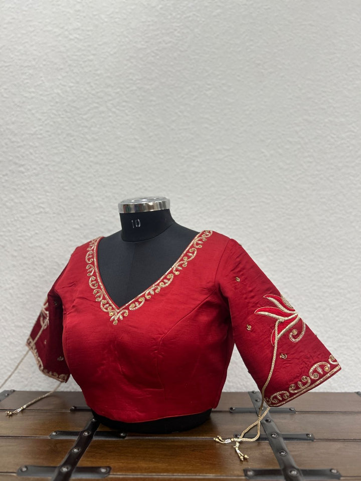 Red raw silk blouse with handcrafted khat embroidery and lotus-inspired sleeve detailing