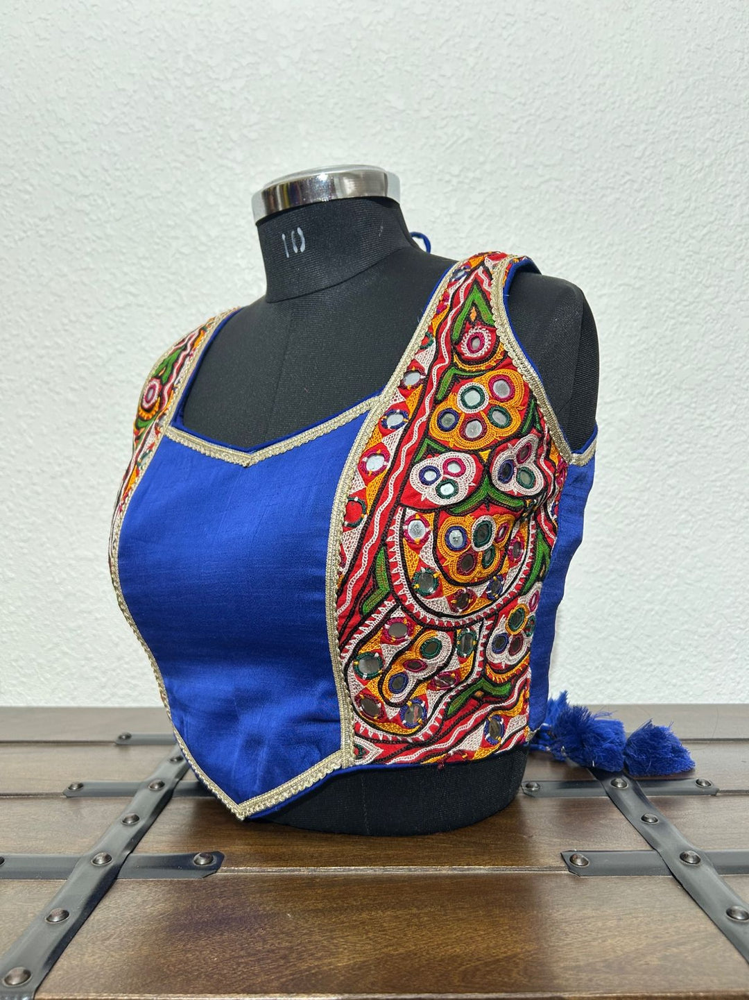 Royal blue festive blouse with vibrant Kutchi embroidery detailing

