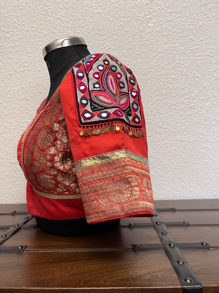Rust Banarasi blouse with kasab embroidery, Kutch patch sleeves, and golden border detailing