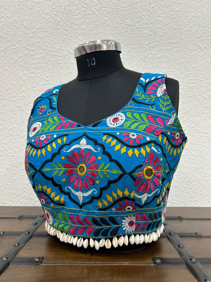 Sky blue cotton blouse with handcrafted Kachchhi Bharat embroidery and kodi waist detailing